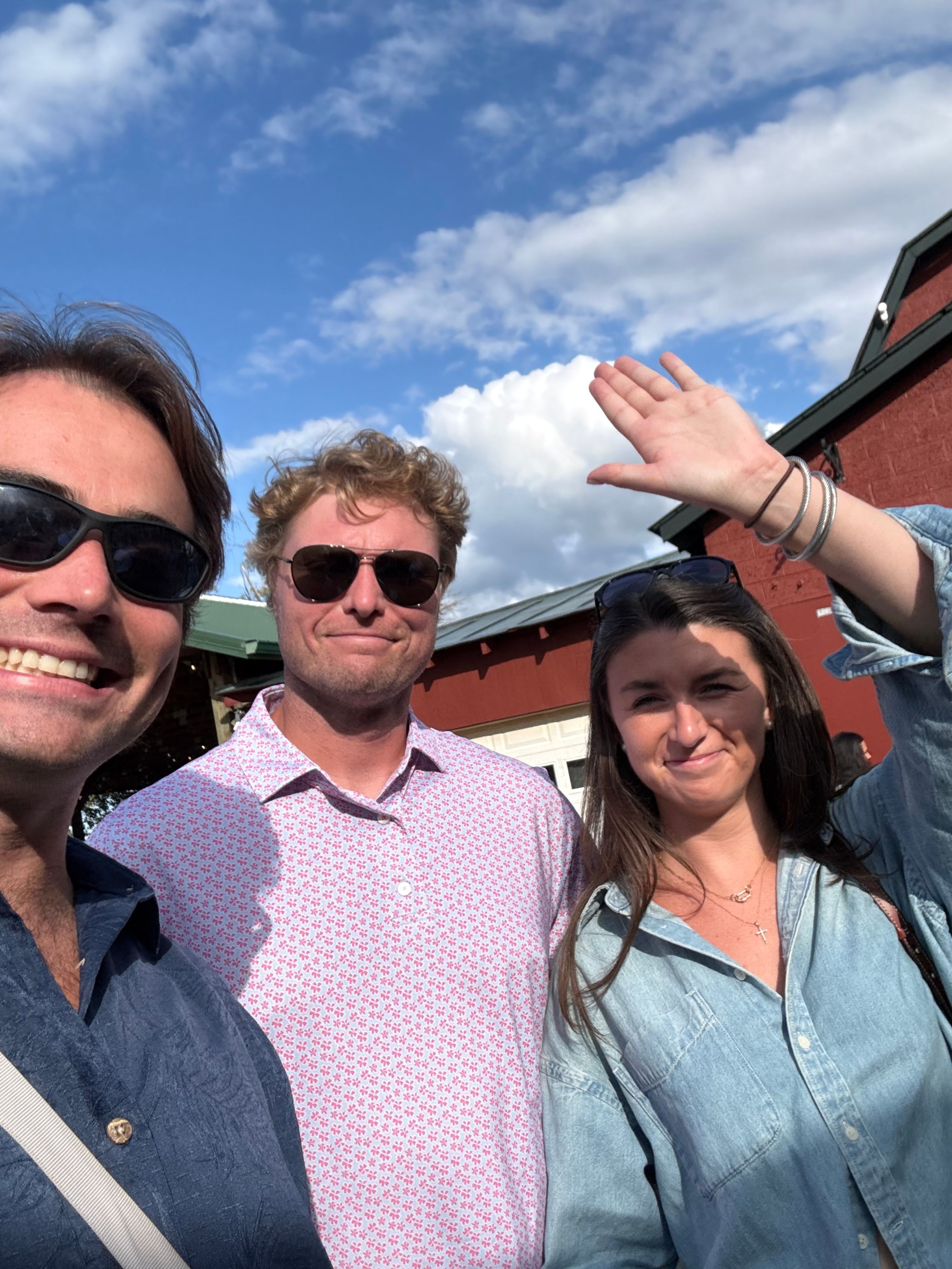 Friends in front of a red barn